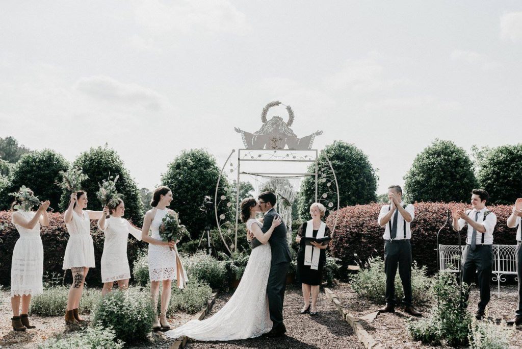The Little Herb House | ceremony in the garden | kiss